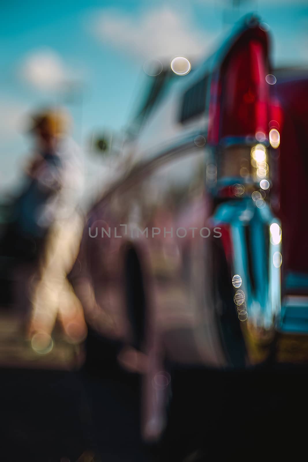 Colorful abstract background retro car. Boke background with copy space. Close-up view vintage American auto details with bubble bokeh effect.