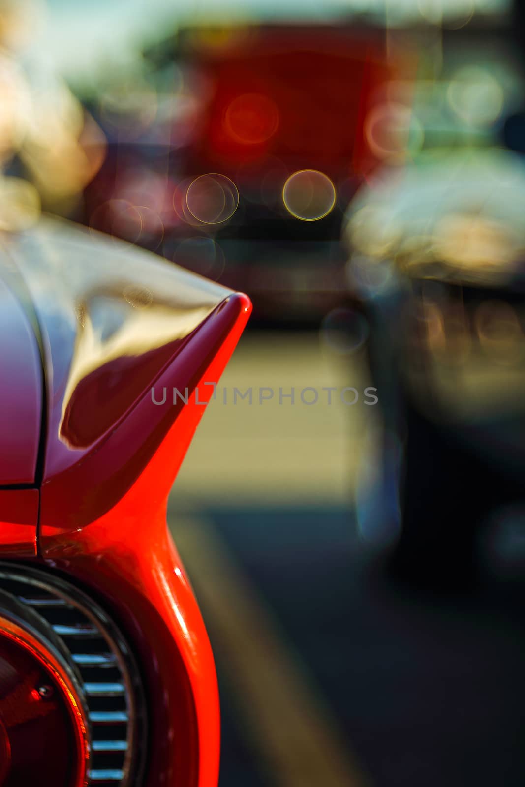 Retro rear headlight lamp vintage classic car. Soft focus, boke background with copy space. Close-up view part of a vintage old car with bubble bokeh effect.