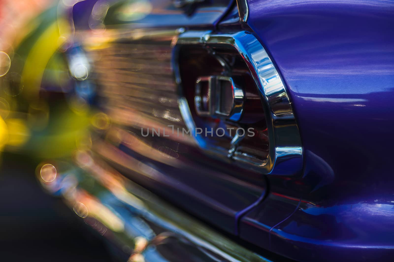 Retro rear headlight lamp vintage classic car. Soft focus, boke background with copy space. Close-up view part of a vintage old car with bubble bokeh effect.