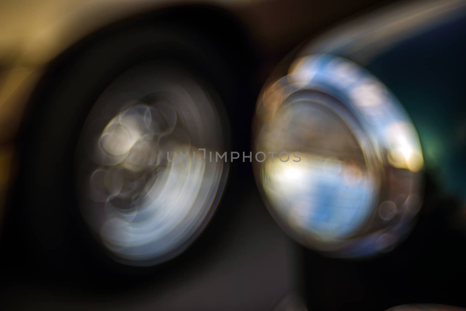 Abstract background with bokeh defocused classic car. Colorful abstract background retro car. Boke background with copy space. Close-up view vintage auto details with bubble bokeh effect.