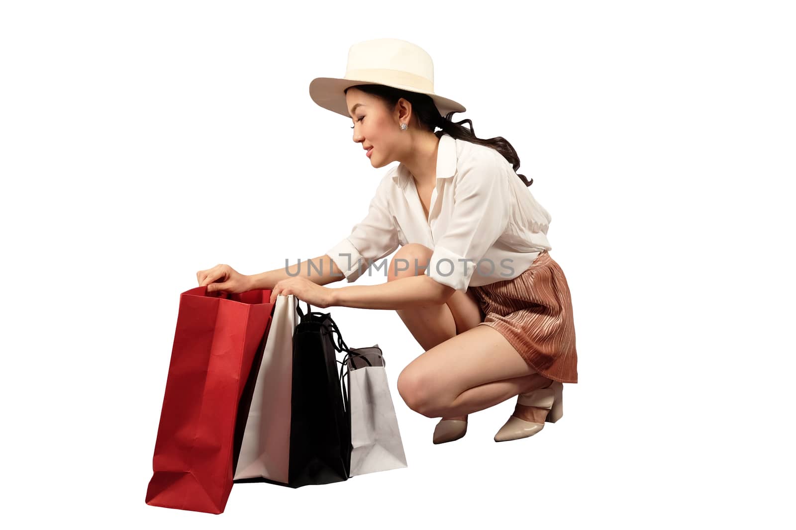 a happy women with shopping bag on white background with clippin by Surasak