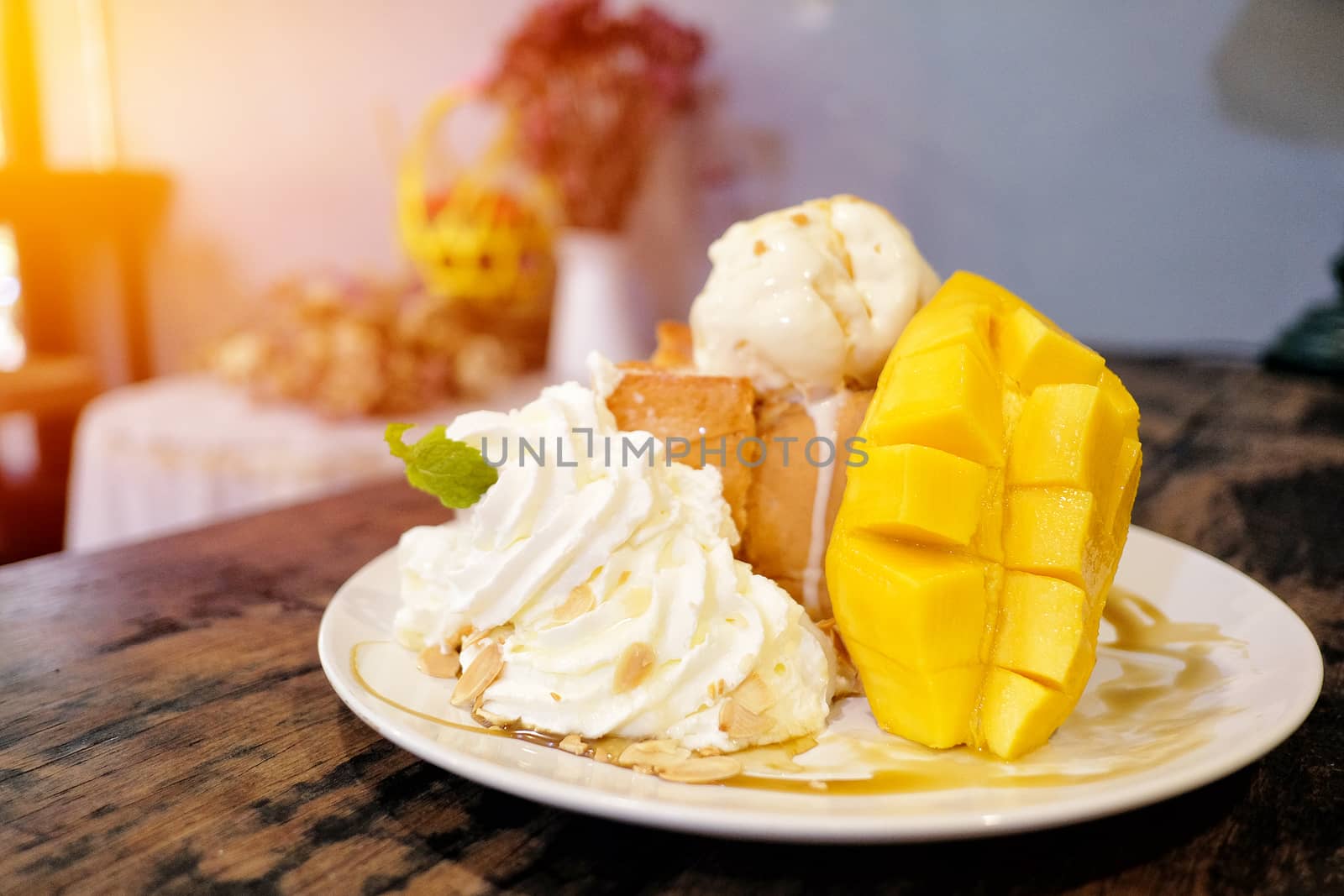 Ice cream with ripe mango and sticky rice in a coconut milk Thai by Surasak