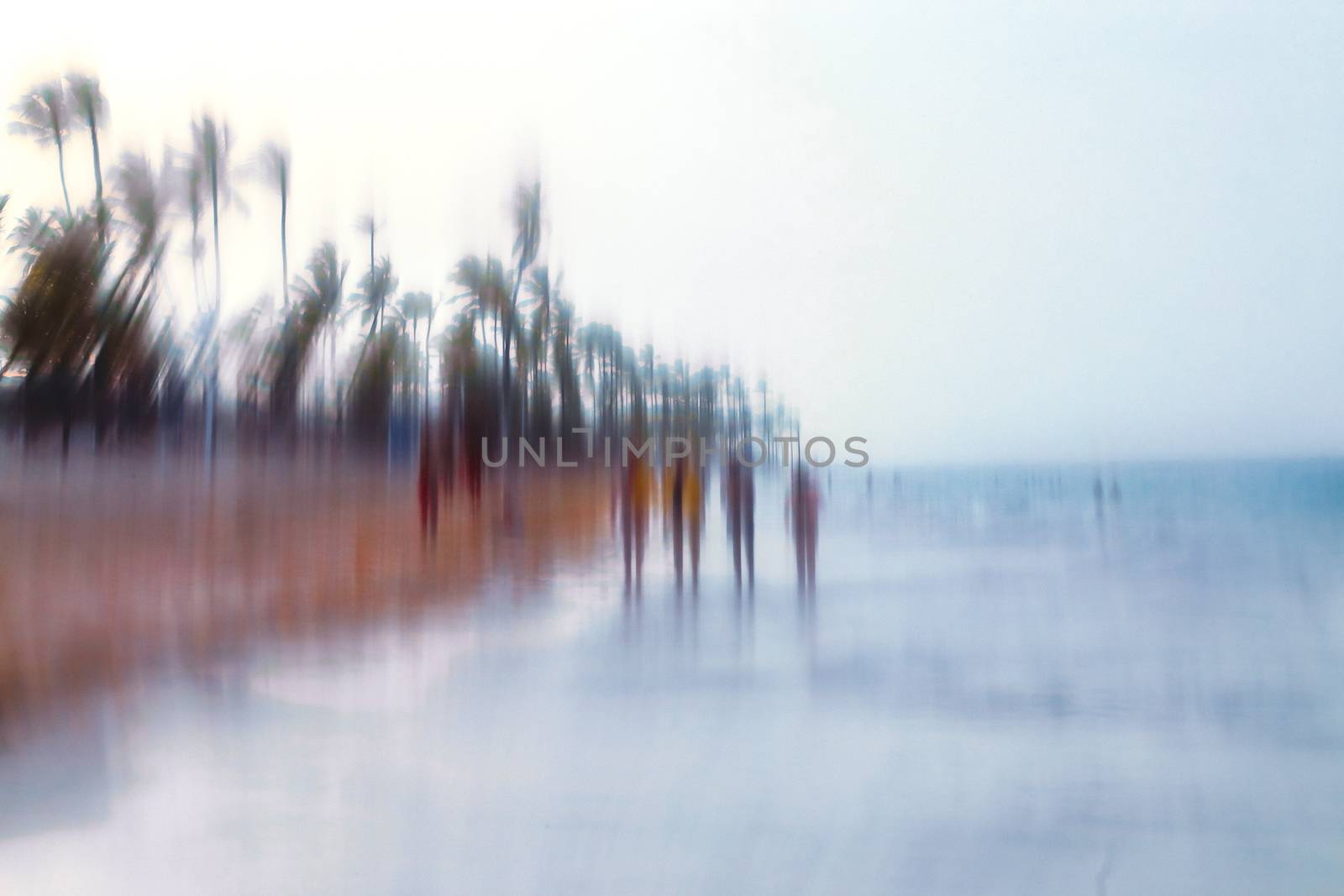 Abstract background image of people walking on the beach in the style of the Impressionists. Soft focus. A blurring technique creates a unique impressionist style. Pastel colours.