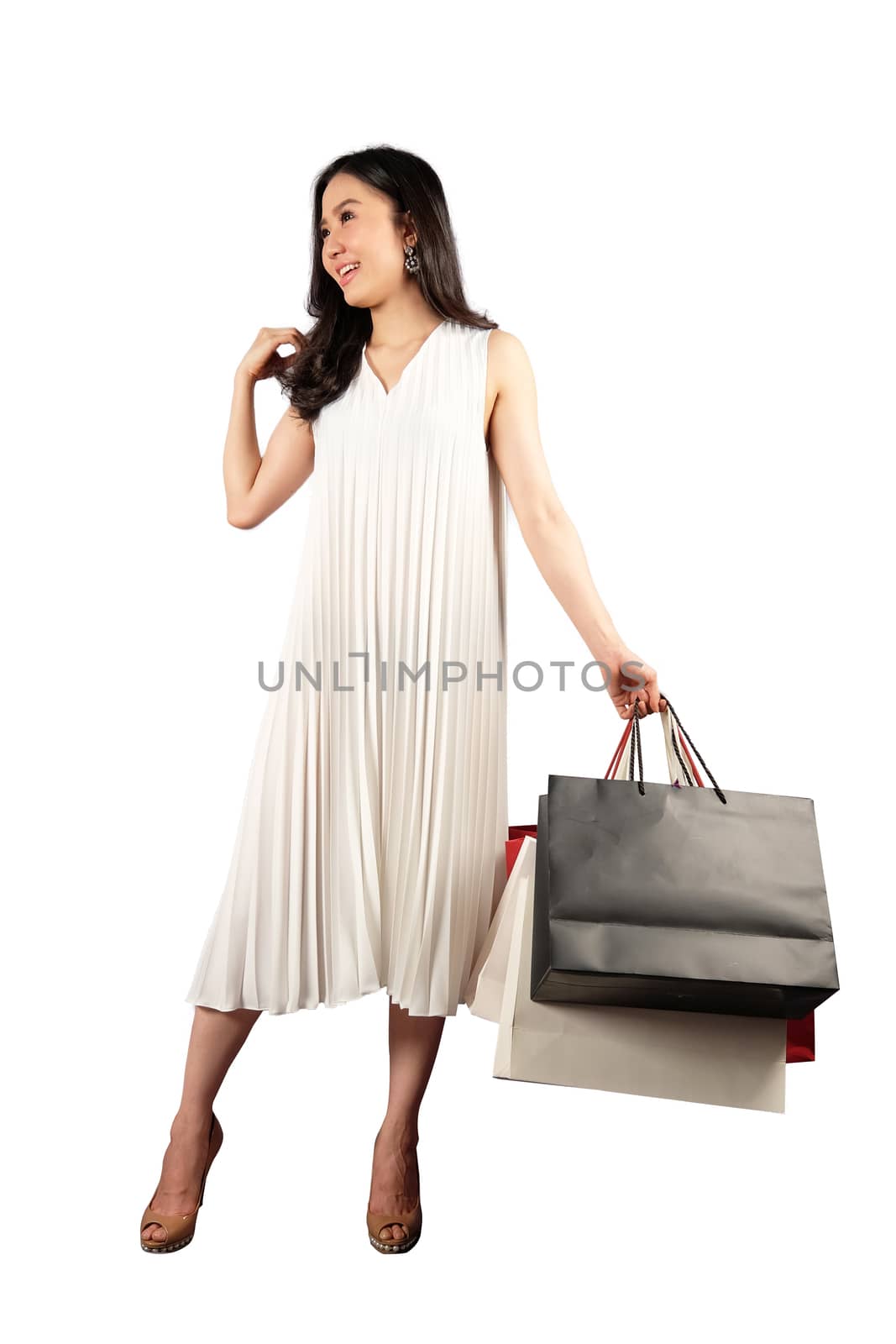 a happy women with shopping bag on white background with clippin by Surasak