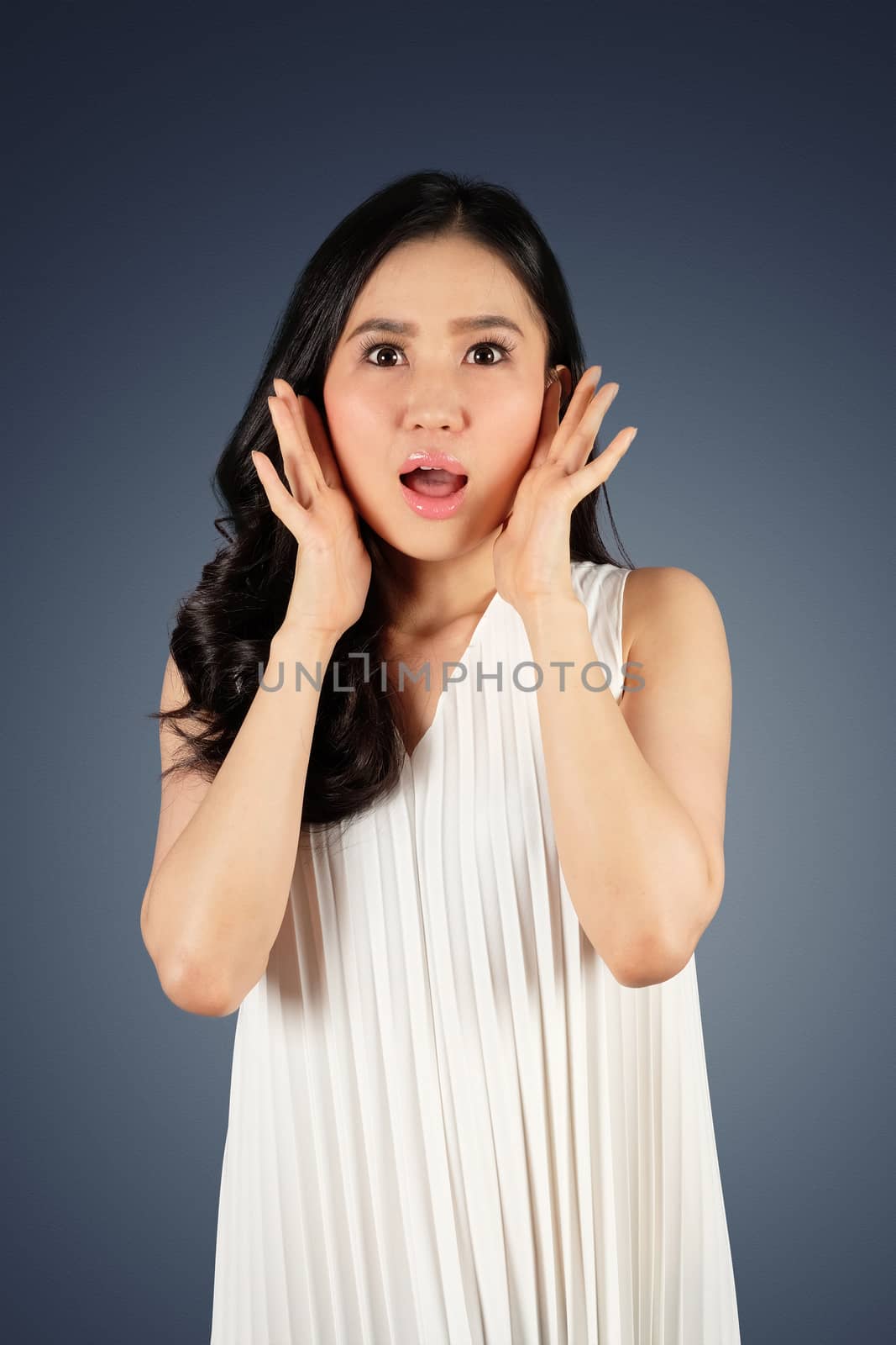 Shocked woman wearing stylish hat looking at camera and white background with clipping path