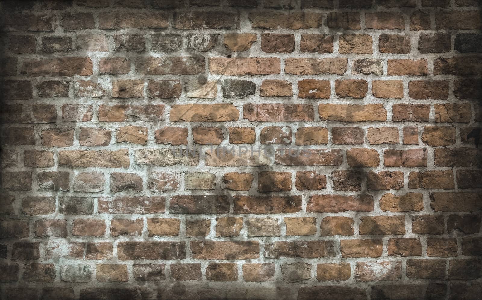 Aged and weathered old brick wall texture in a vintage retro design 