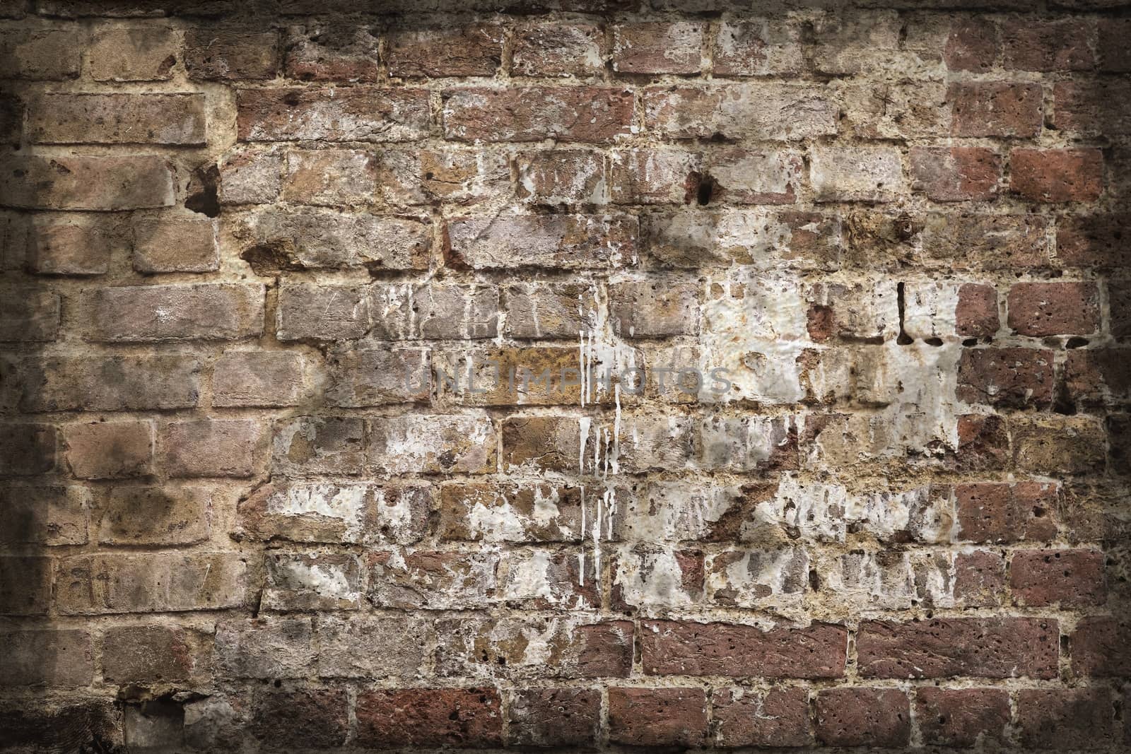 Aged and weathered old brick wall texture in a retro vintage des by MP_foto71