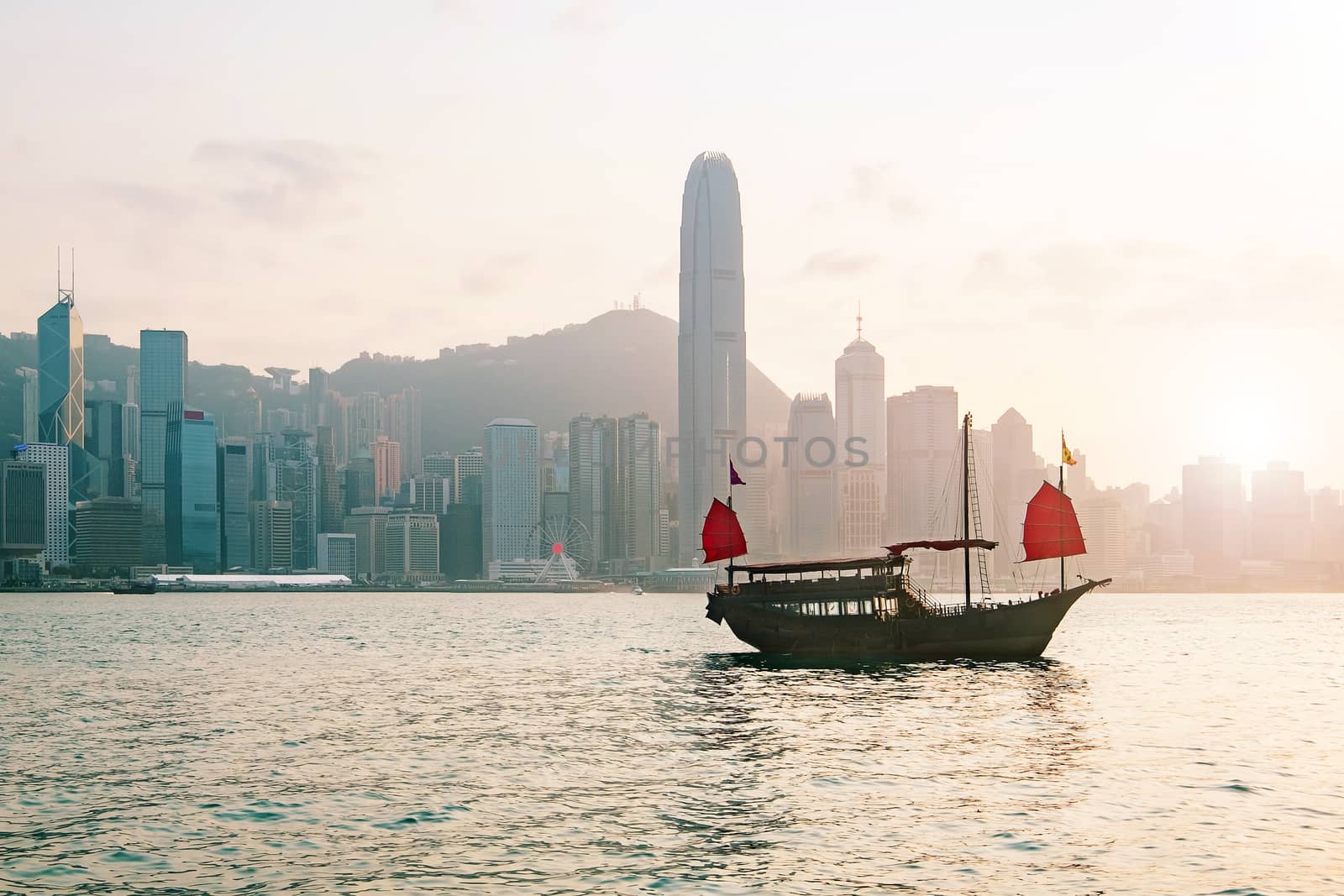 Hong Kong skyline with a traditional boat seen from Kowloon, Hong Kong, China.