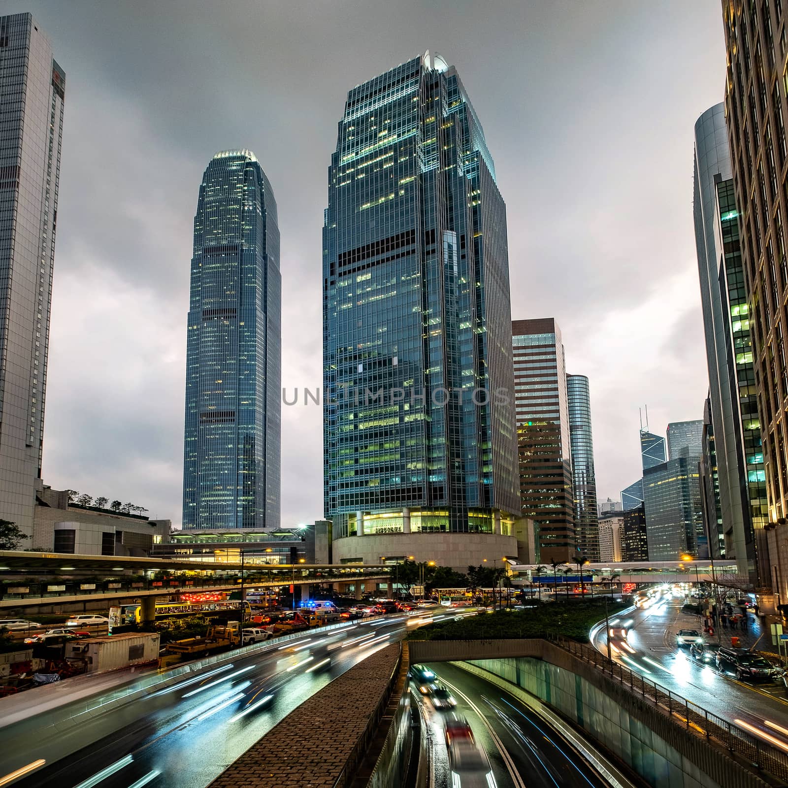 Hong Kong skyline at central business district with light trail. by Tanarch