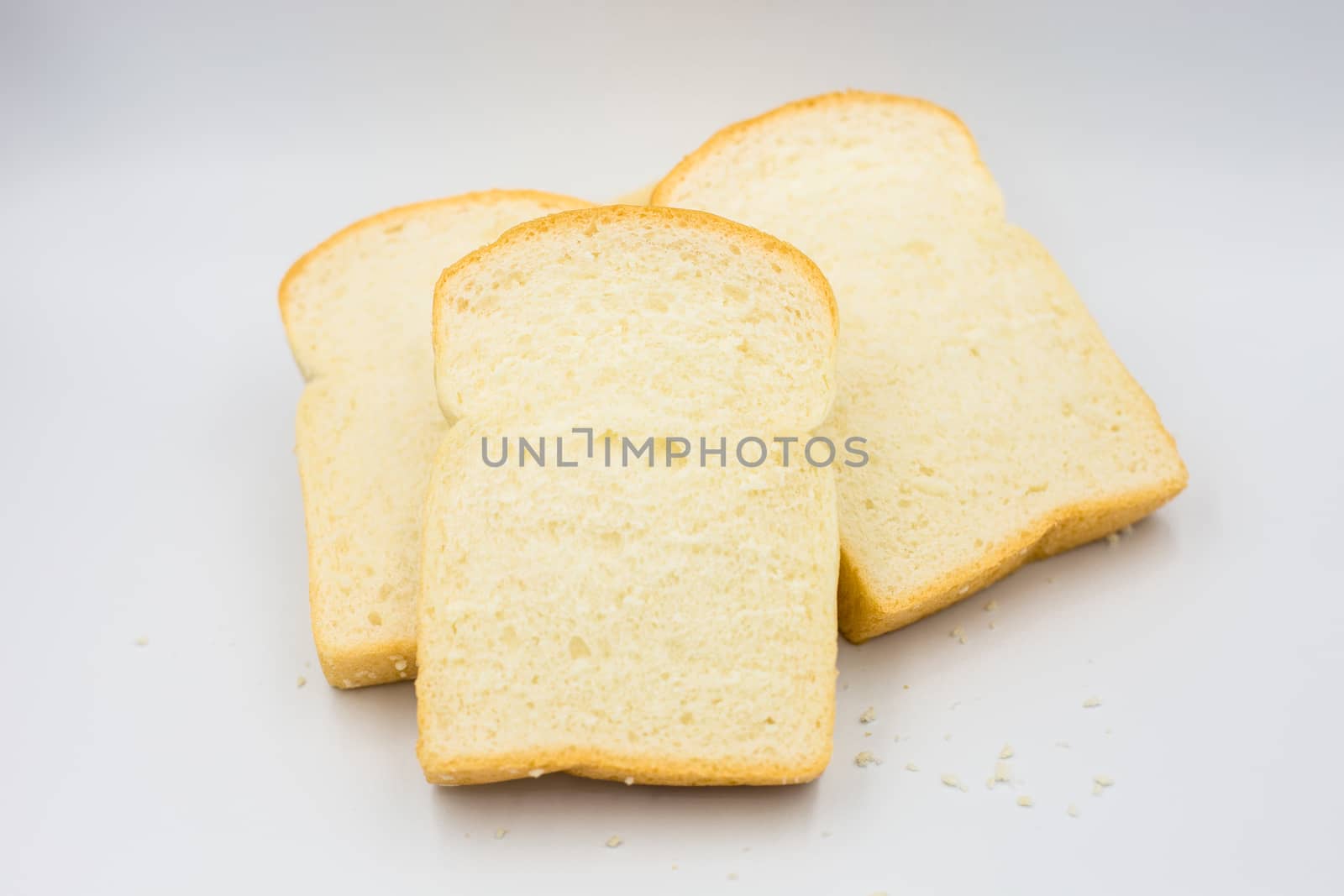 Three slices of bread on a white background.