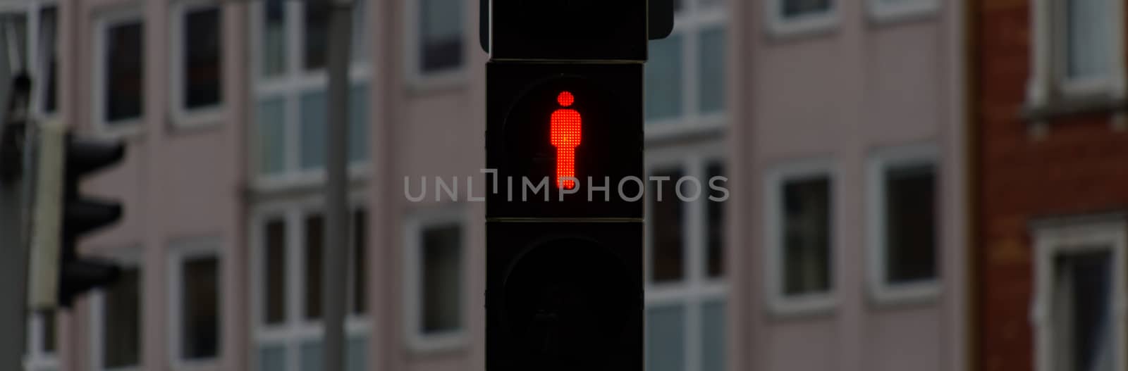 Standstill, red traffic light for pedestrians to stop sign and stop walking, background is blurred by fading depth of field. by geogif