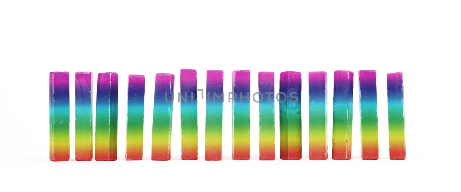 Row of vintage building blocks isolated on white background - Rainbow colored