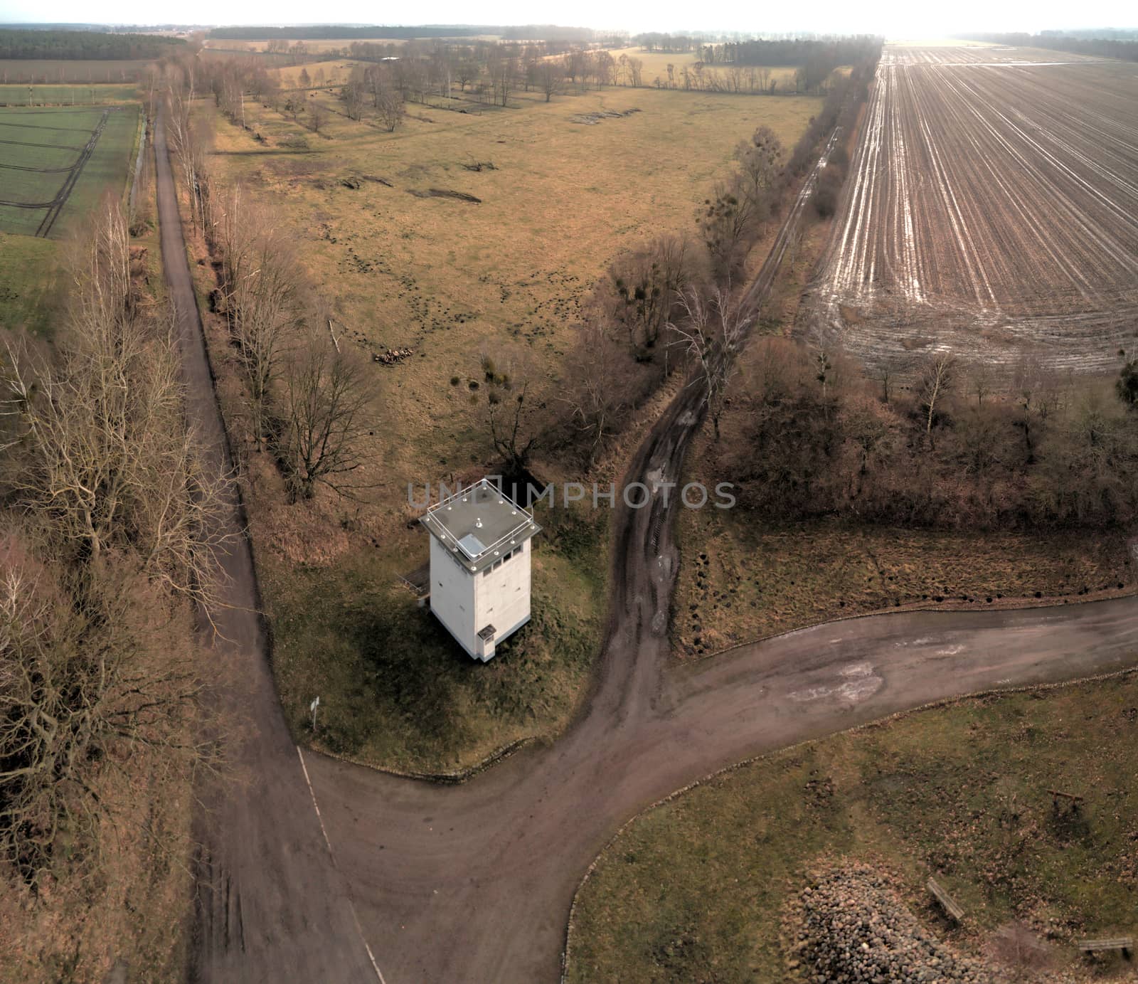 Aerial photo of a former watchtower at the border fortifications between the GDR and the FRG. Open-air exhibition in a forest near Kaiserwinkel on the border of Lower Saxony and Saxony-Anhalt. Made with drone