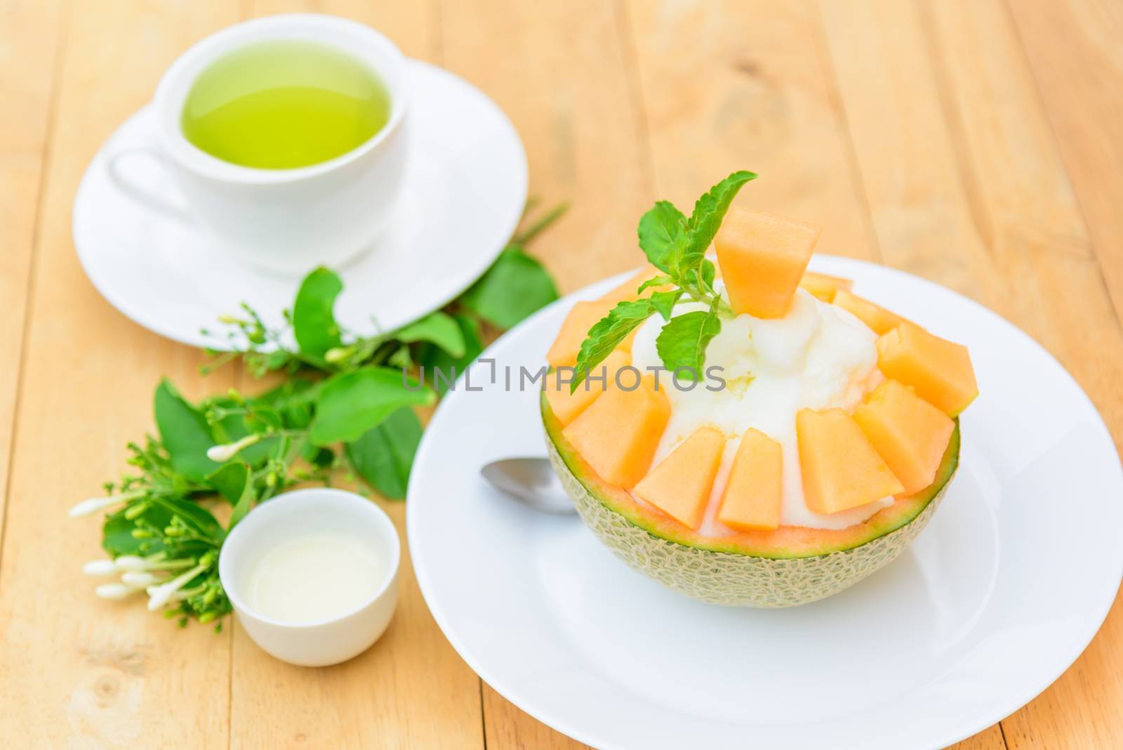 Melon Bingsu with Sweetened Condensed Milk on wood table