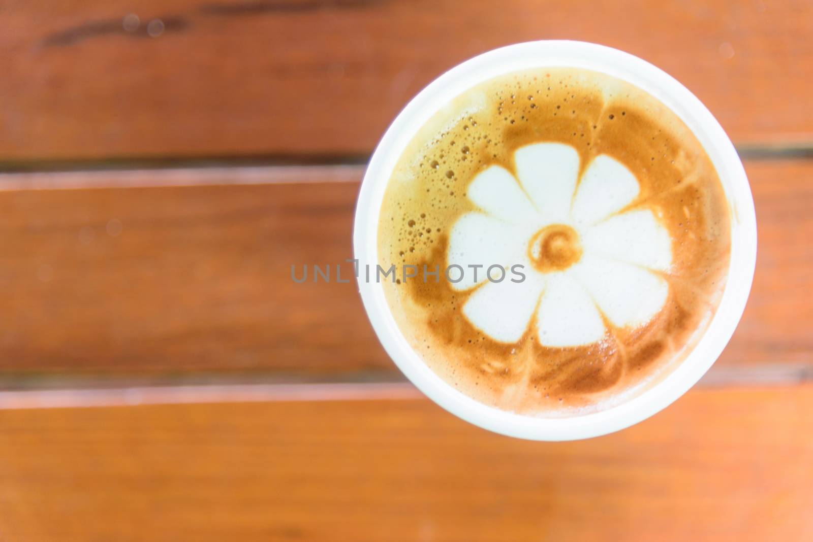 hot coffee on table / hot cappuccino with nice pattern milk foam by rukawajung