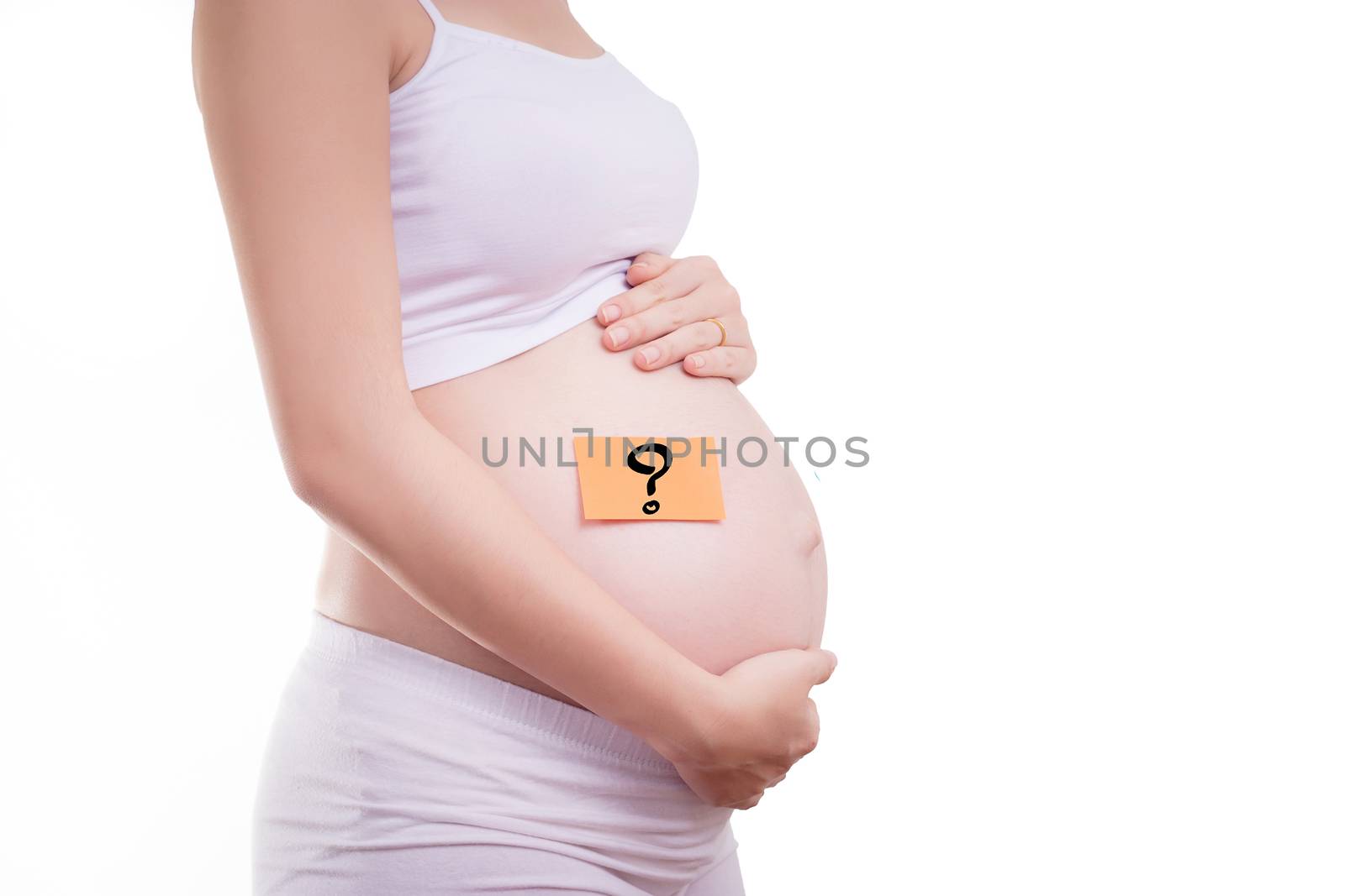 Pregnant woman with stick notes on her belly, anonymous face