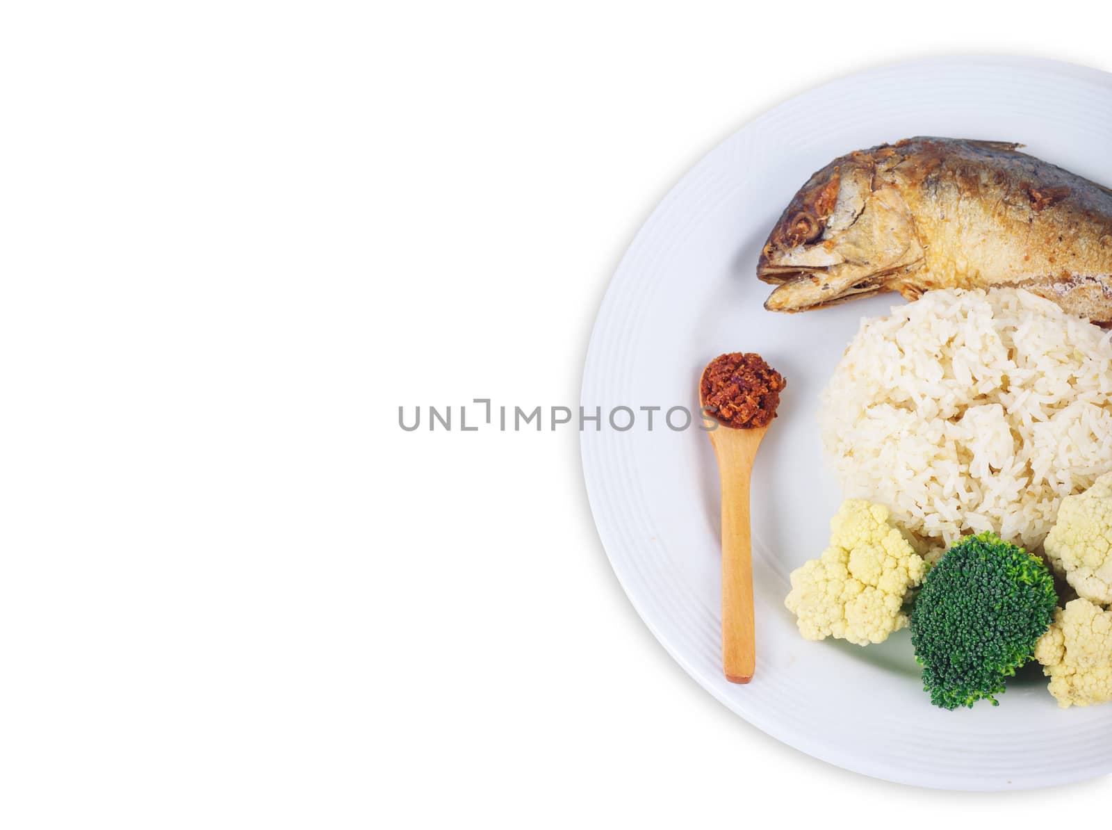 Mackerel fried with chilli sauce Thai style food. Healthy food. Mackerel fish with carrot and broccoli on white flat plate isolated on white background from top view