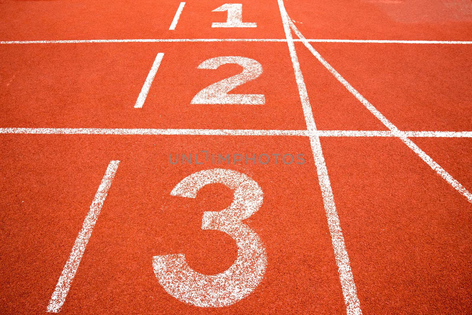 orange running track with white line and number  by asiandelight