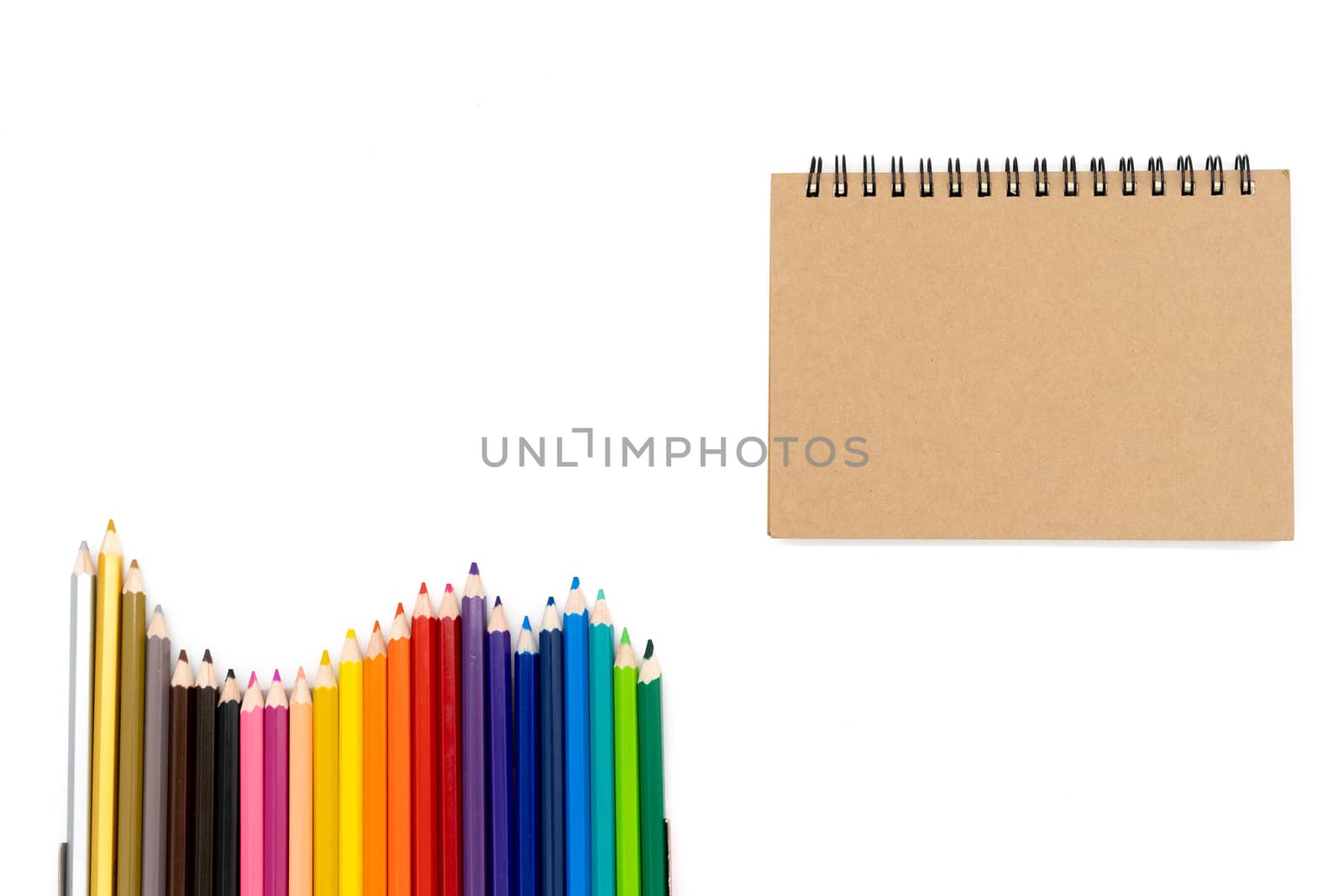 24 colored pencils arranged in a wave pattern on the bottom left of the picture and watercolor books in the upper right corner of the picture and all on a white background...