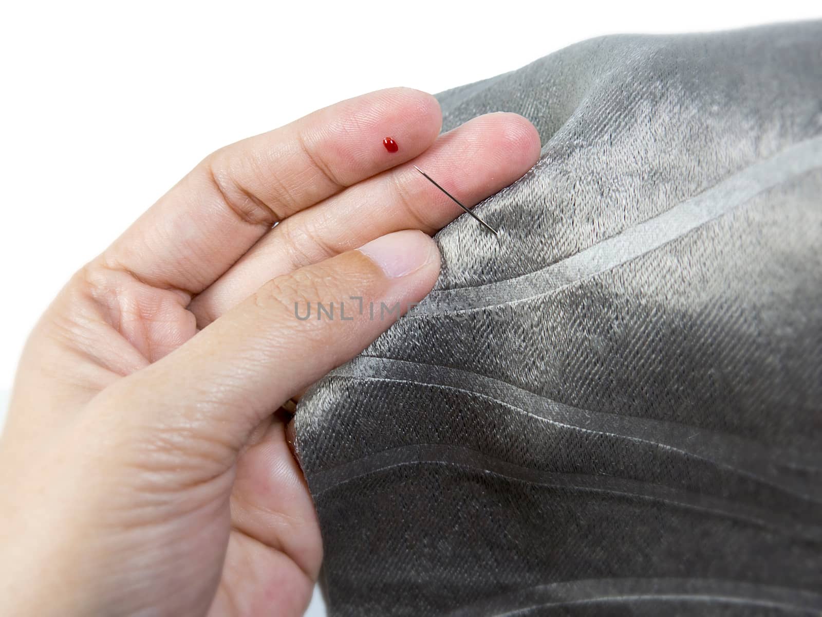 blood at finger accident by needle from sewing by asiandelight