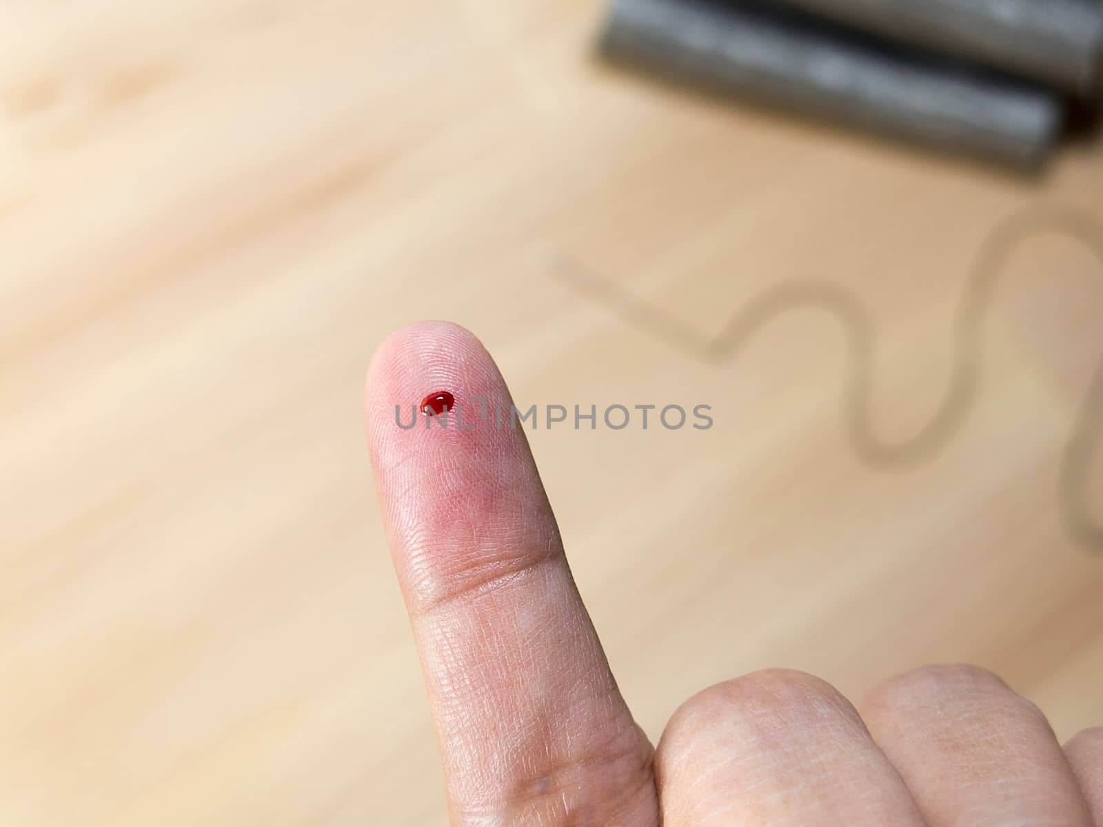 blood at finger accident by needle from sewing by asiandelight