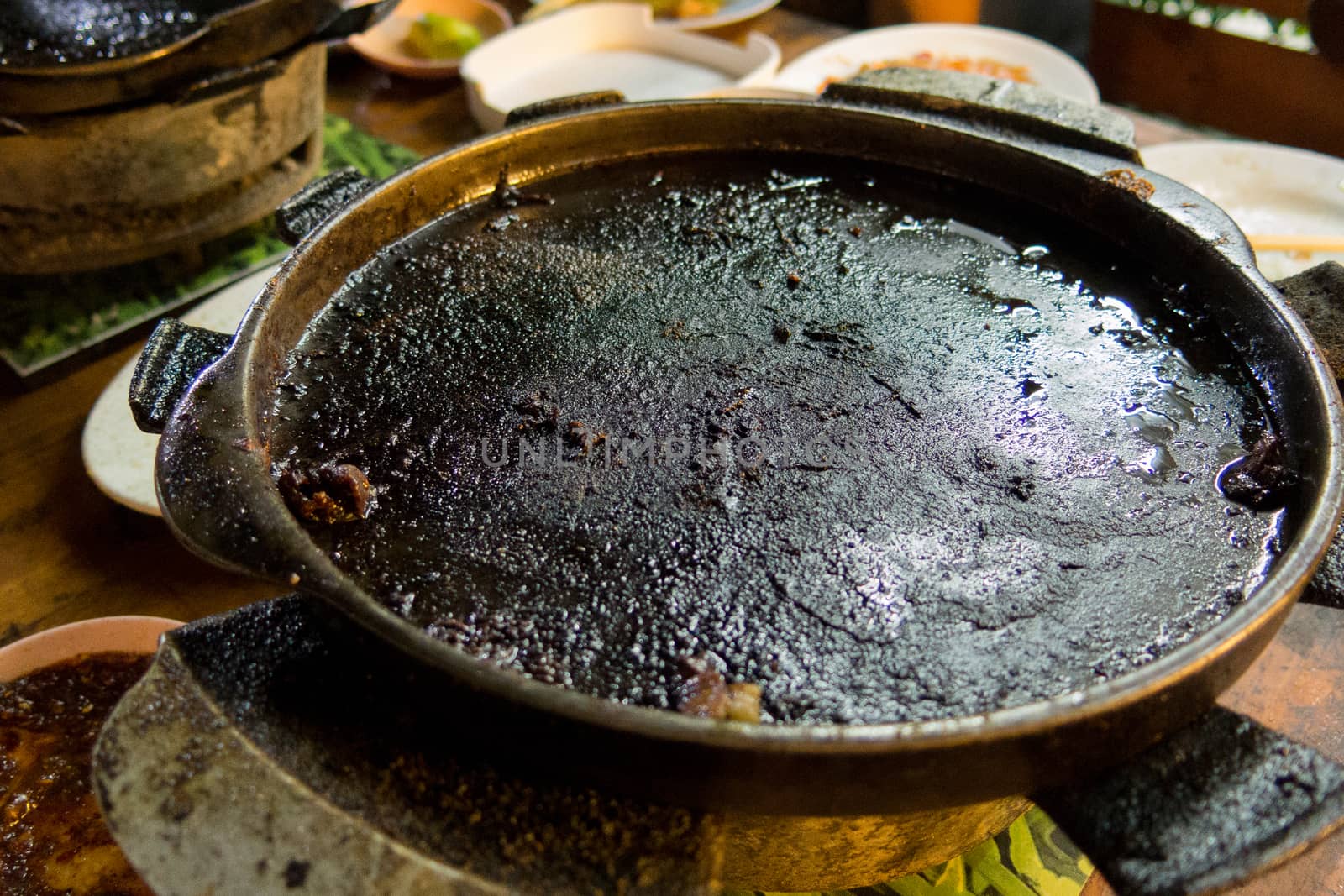 food and healthy concept. dirty burned flat pan high chance to be cancer by asiandelight