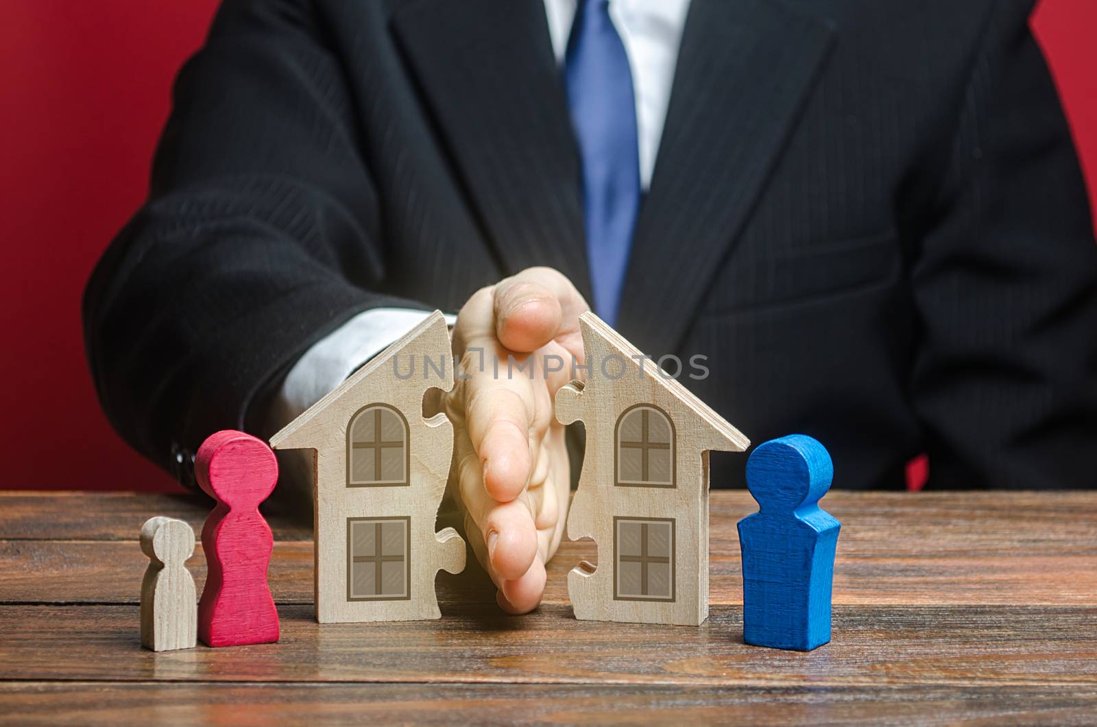 Man shares a house between former spouses in a divorce process. Disputes over fair division of marital property real estate. Protection of rights. Conflict resolution. Court, justice. Lawyer services