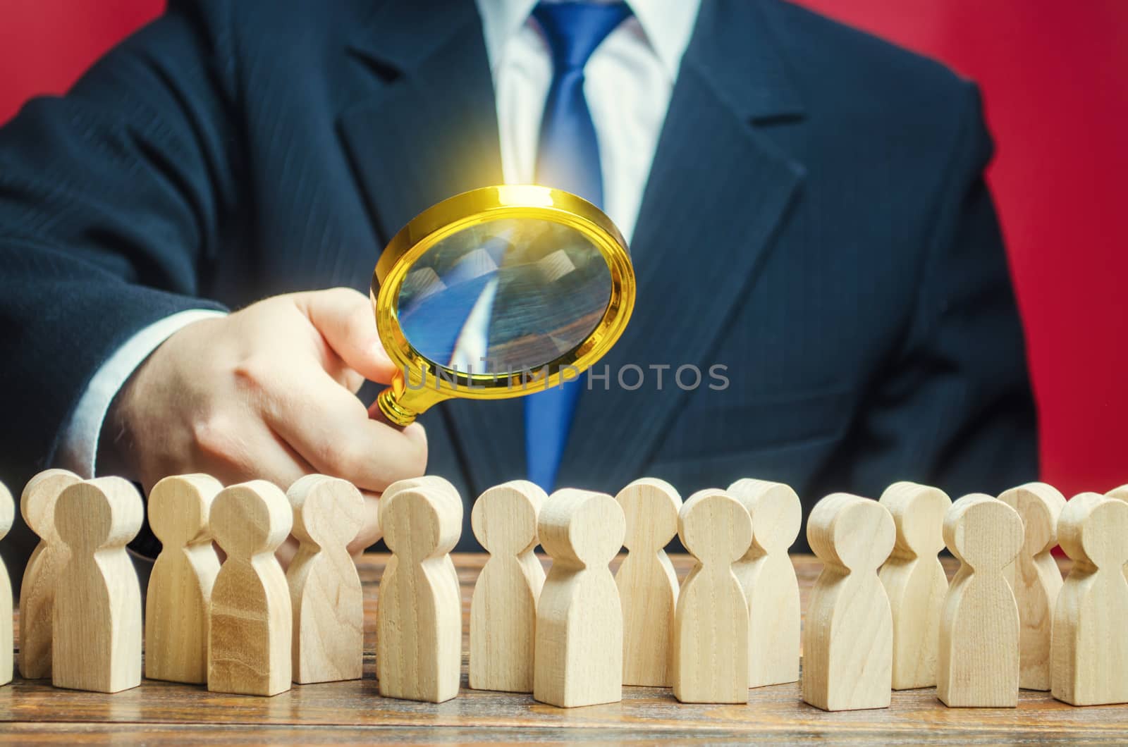 Man studying a crowd of people with a magnifying glass. Market and customers research. Hr search candidates for work, staff recruiting. Society, demographic. Citizens electorate. Analysis by iLixe48