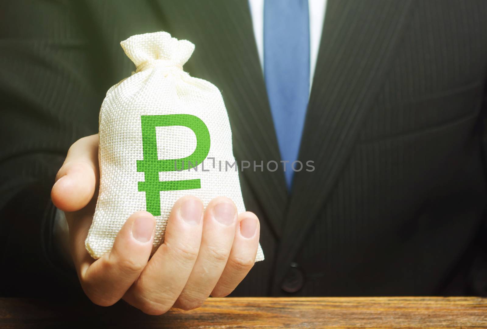Man holds out a russian ruble money bag. Provision of money on credit, grant. Project financing. Donations. Financial social assistance. Payment purchases, profits dividends. Business investment by iLixe48