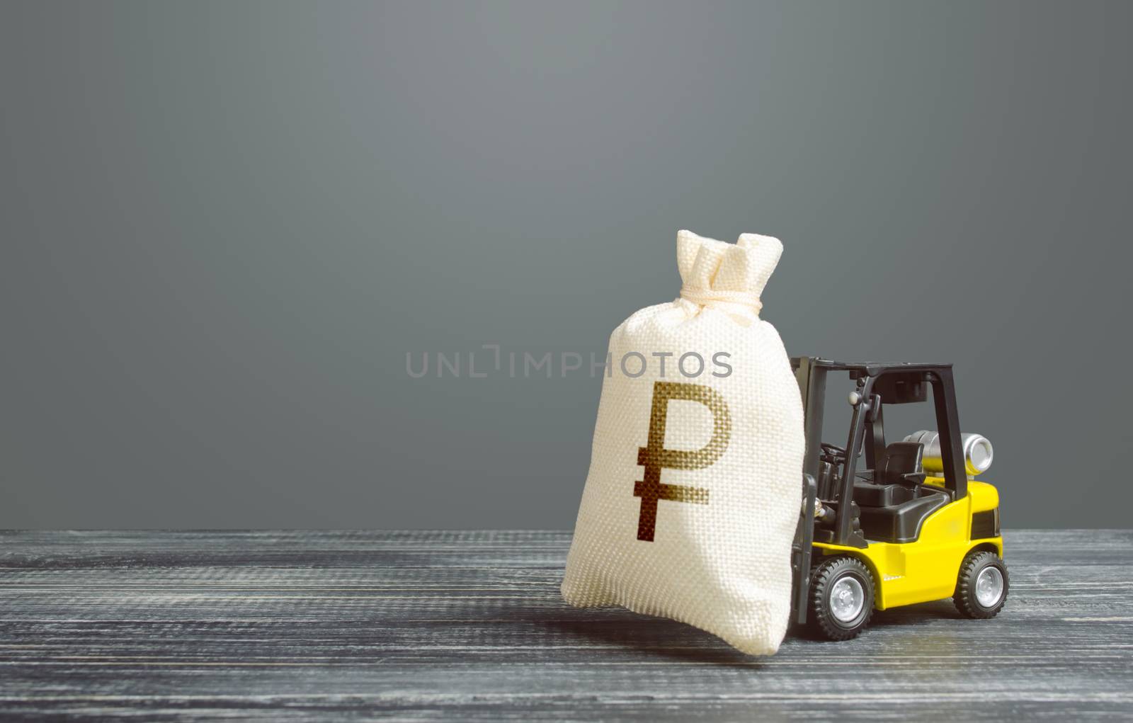 Yellow forklift carries a russian ruble money bag. Big contract, profitable deposit, take a loan. Inflation, price increases. Wealth, investments in economy. Grants financing. Payment of taxes.