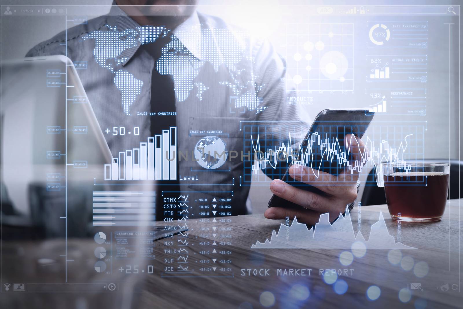 Investor analyzing stock market report and financial dashboard with business intelligence (BI), with key performance indicators (KPI).success businessman hand using smart phone,digital tablet docking smart keyboard,coffee cup.