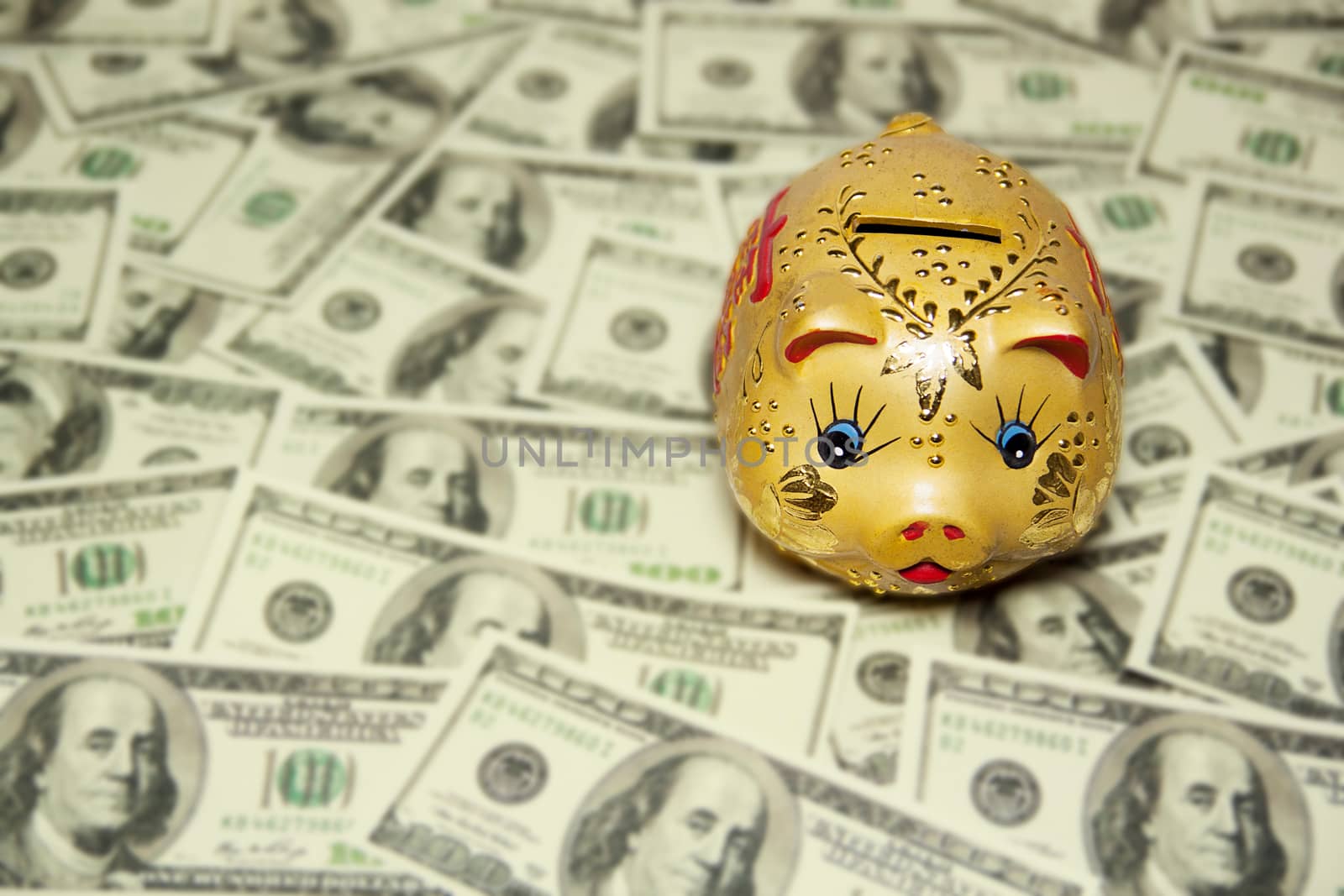 gold piggy bank on dollars banknote background . financial and saving concept by asiandelight