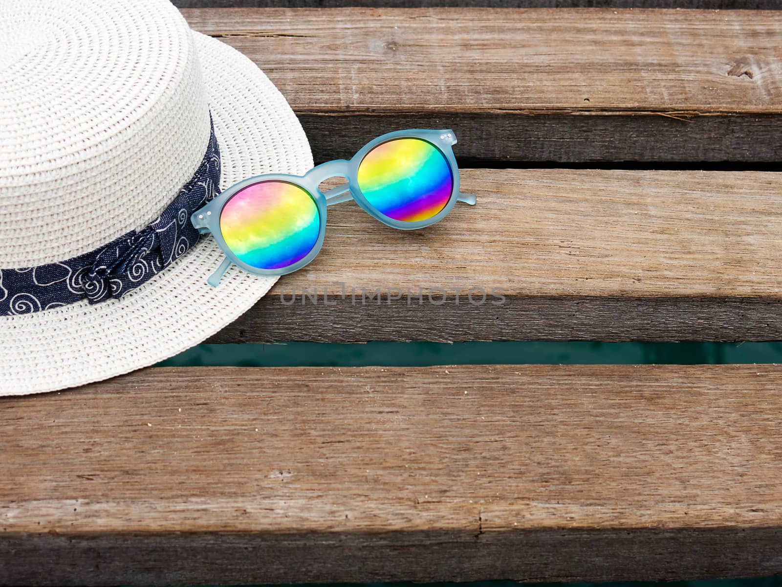 vacation on summer time at the beach concept. beach accessories on wooden bridge. summer background. by asiandelight