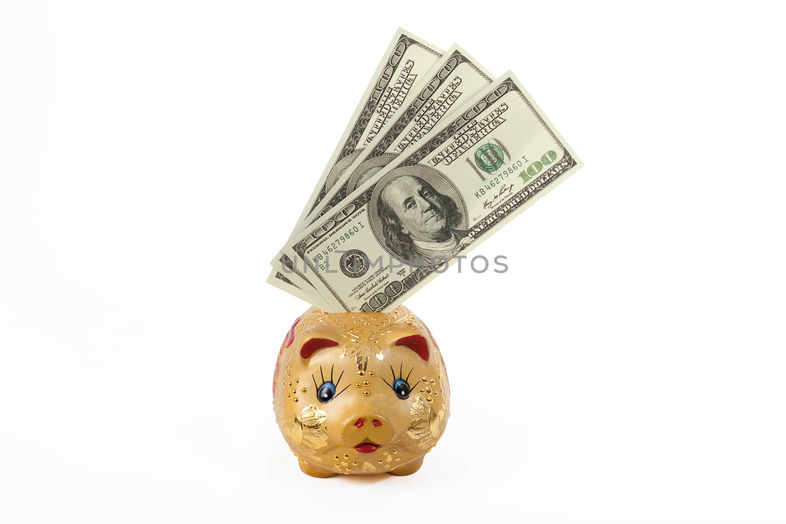 Saving, putting dollars into piggy bank with clipping path. financial and saving concept