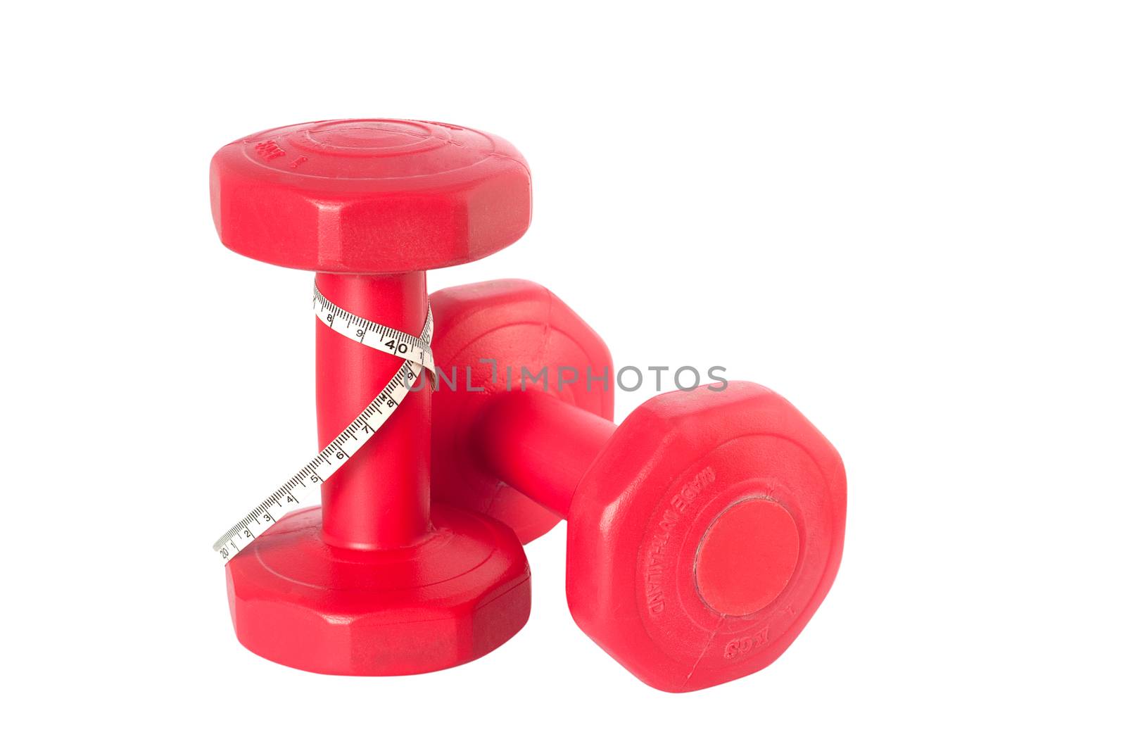 Two of dumbbells with measure tape Isolated on white background clipping path by asiandelight