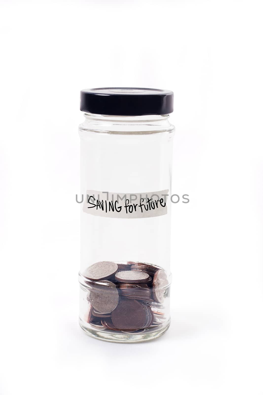 Coins in glass jar on white background for money saving financial concept by asiandelight