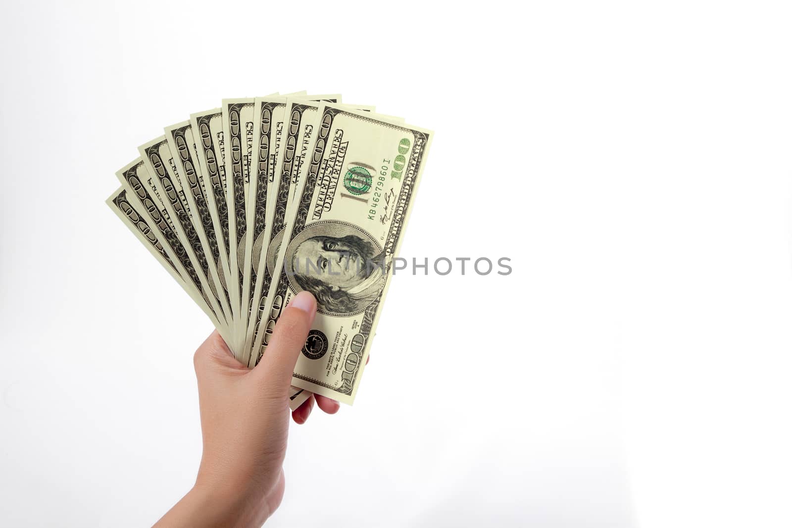 woman hand with one hundred dollars banknote isolated on a white background with clipping path by asiandelight