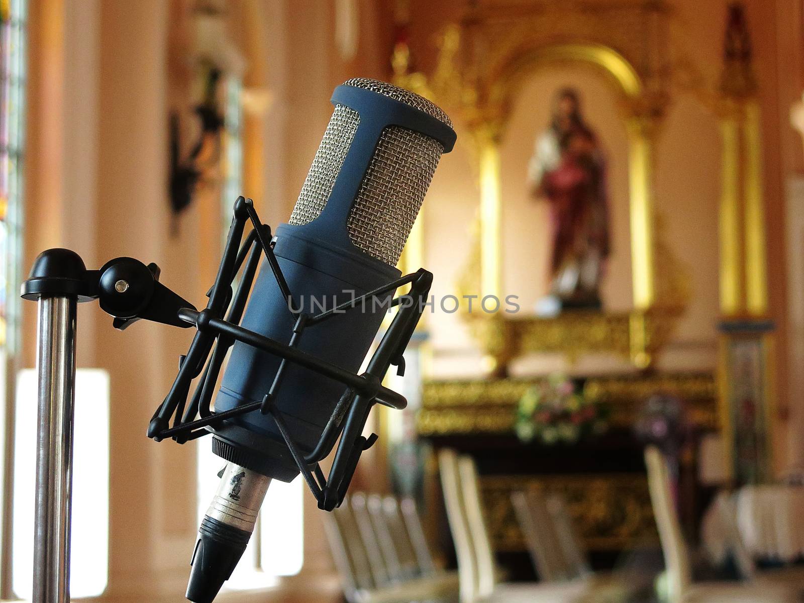 Close up of retro vintage microphone against with blur background in church by asiandelight