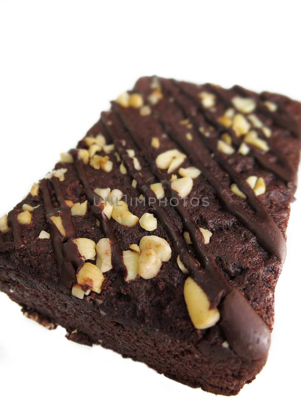 Chocolate brownies isolated on a white background, close up by asiandelight