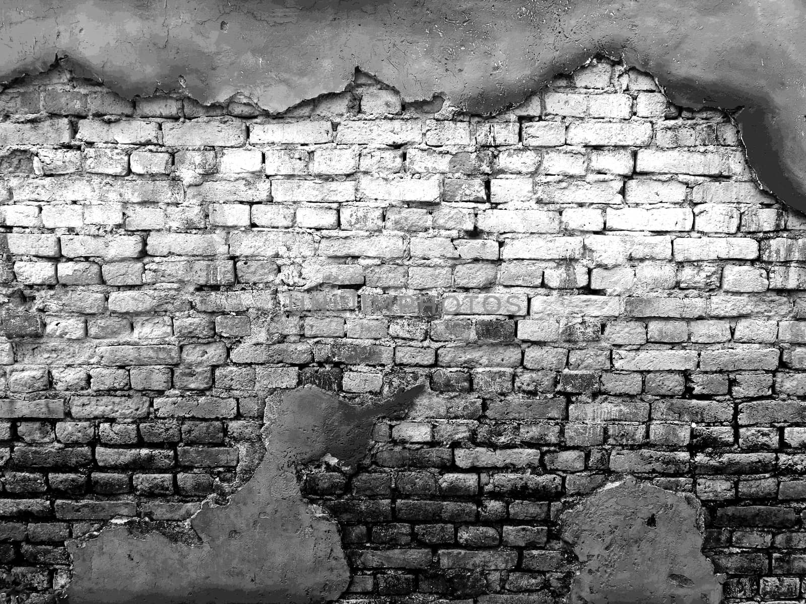 vintage background texture old masonry stone bricks on the ancient cement with cracks. black and white color by asiandelight