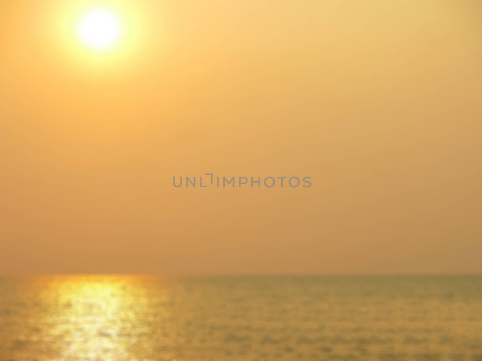 Abstract blur sunset at the sea background. Beautiful orange sea sky just before sunset by asiandelight