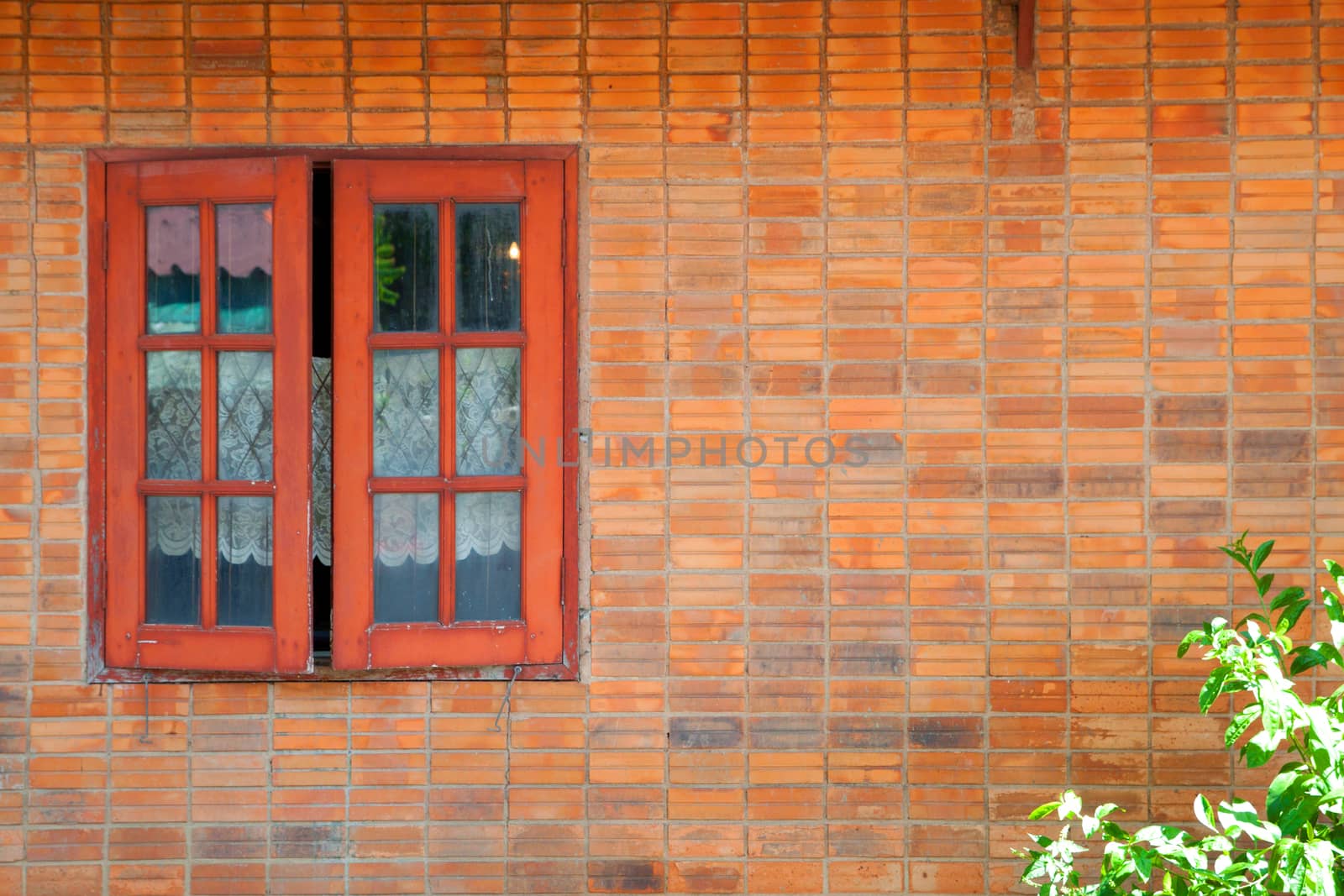 Vintage simple house old brick wall and rustic exterior window shutters at countryside in Asia
