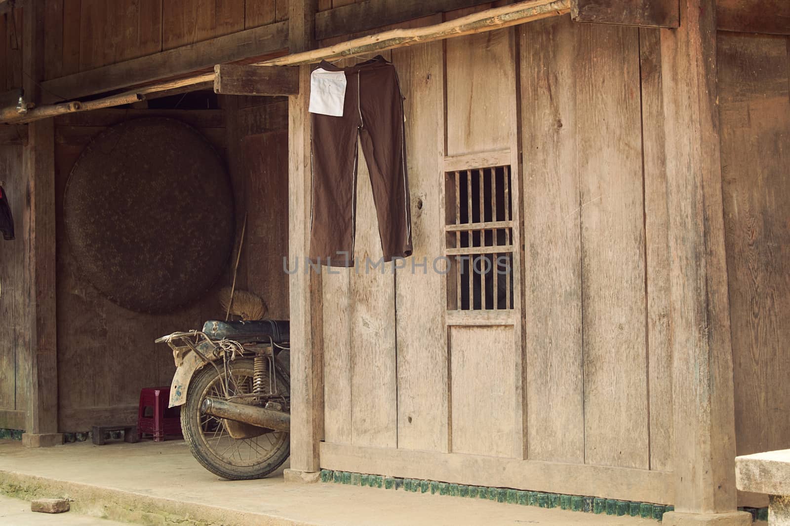 Old wooden house of poor people at countryside in Asia, simply life
