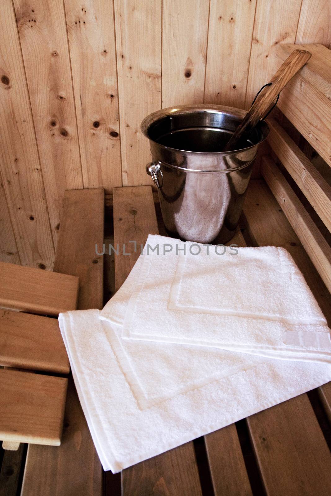 wooden sauna room, shooting objects of sauna equipment with bath towel in the the empty steam room by asiandelight