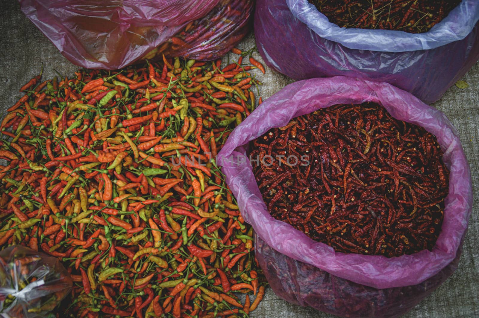 Freshly harvested red chillies sold in Luang Prabang Morning Market in Laos that shows the life, culture and livelihood of the local people