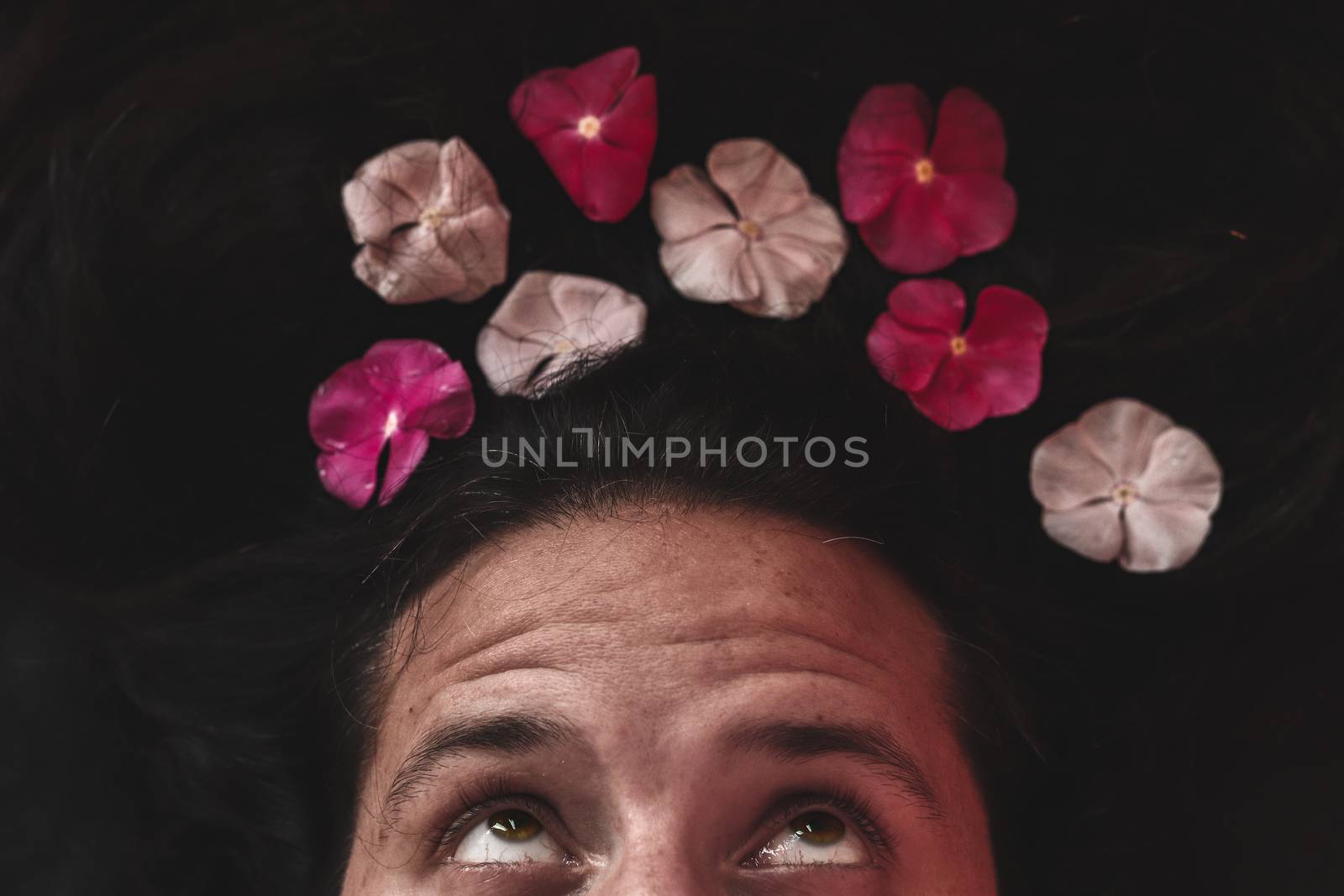 Conceptual photo of man with a flower crown showing concept of Spring, sexuality, lgbtq community and pride month celebration