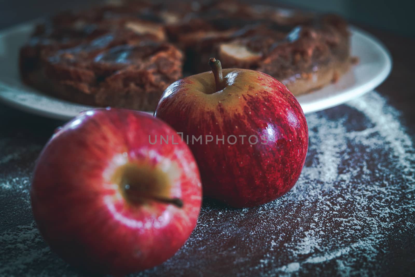 Fresh apples for baking home made apple cake shot in vintage dark and moody theme