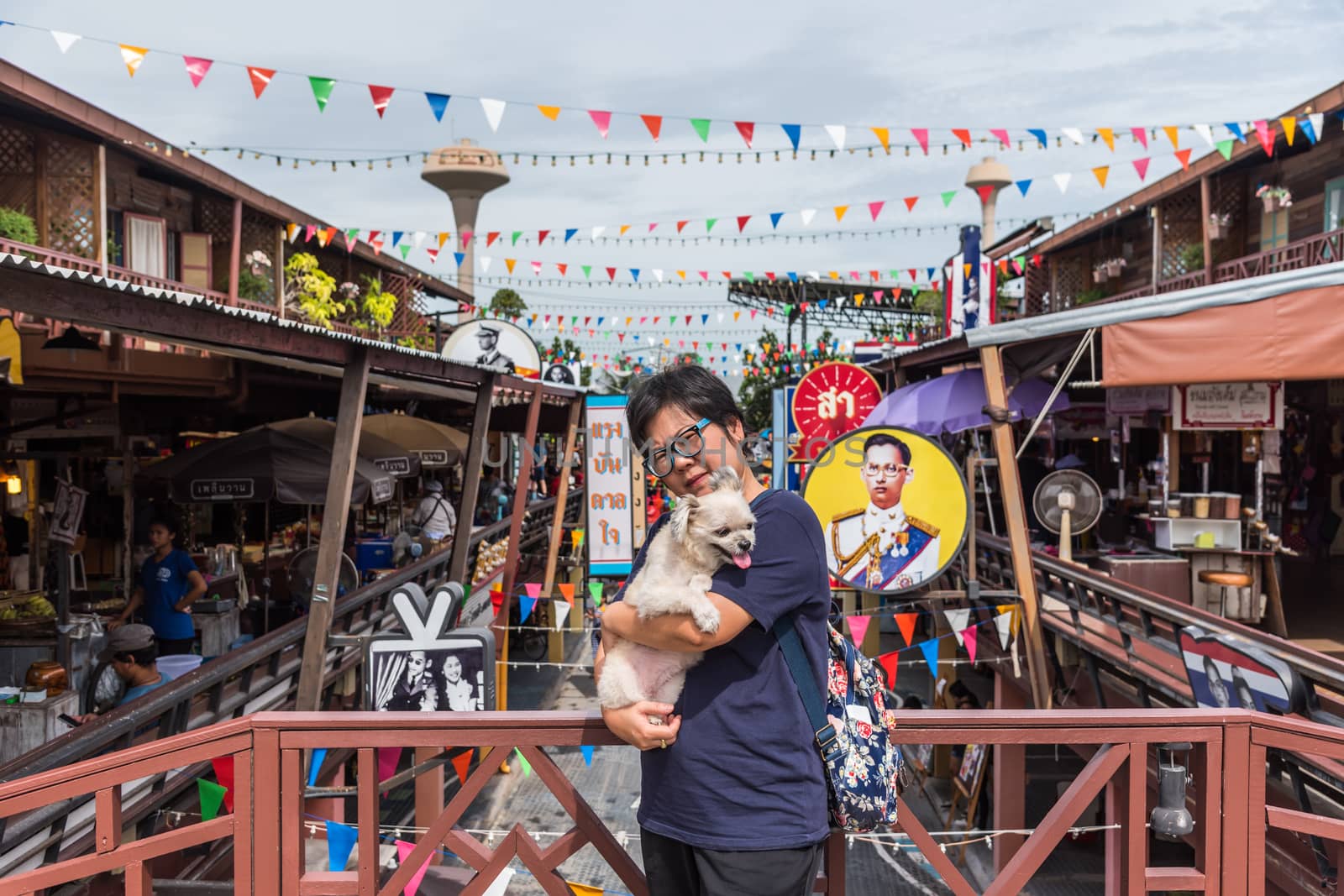 Prachuap Khiri Khan, Thailand - June 18, 2017 : Asian and her dog travel at Mercado de Plearnwan is tourist attraction in Hua Hin recreated retro village plus charming colorful accommodations.