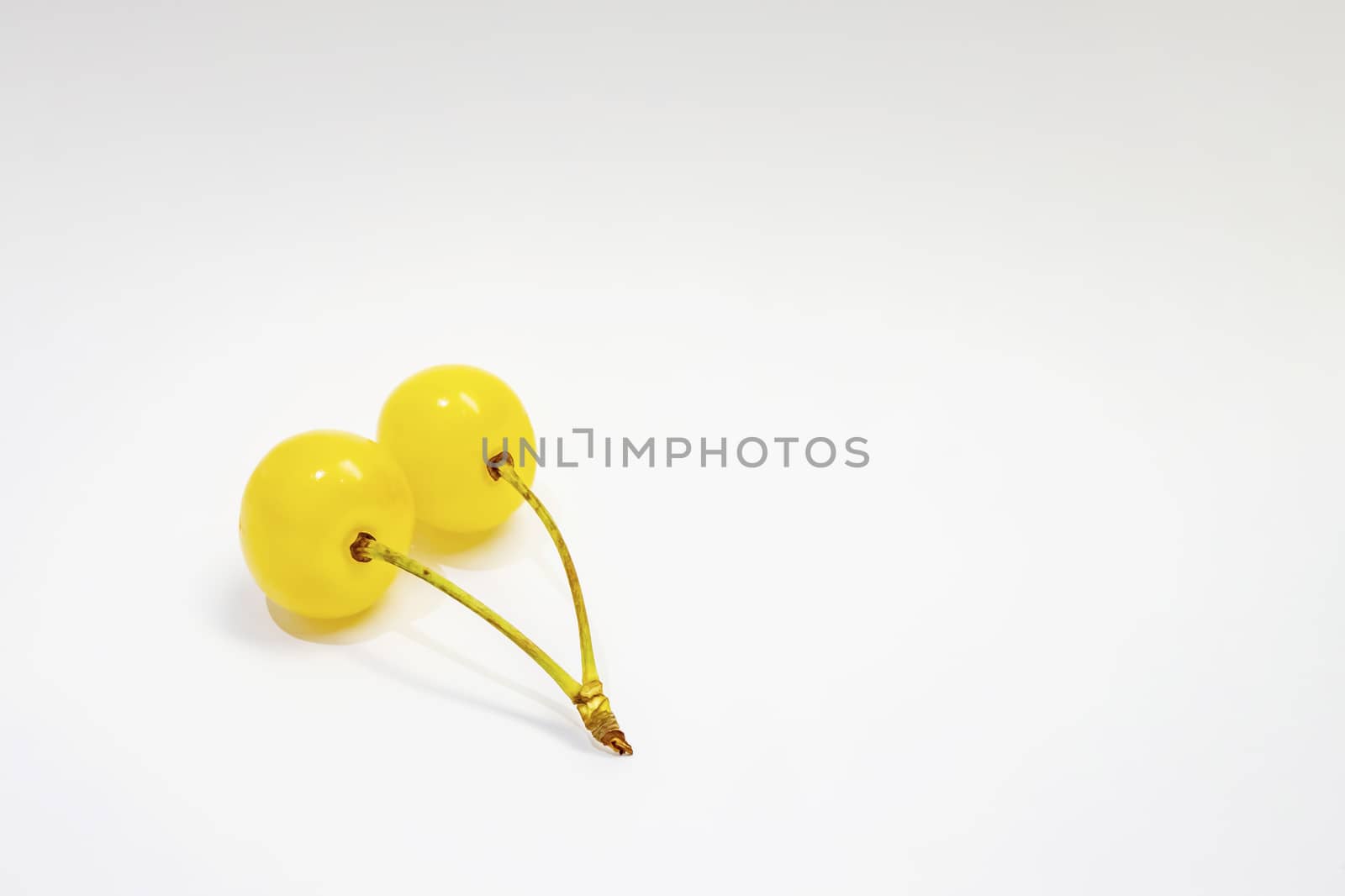 yellow cherry on a white background