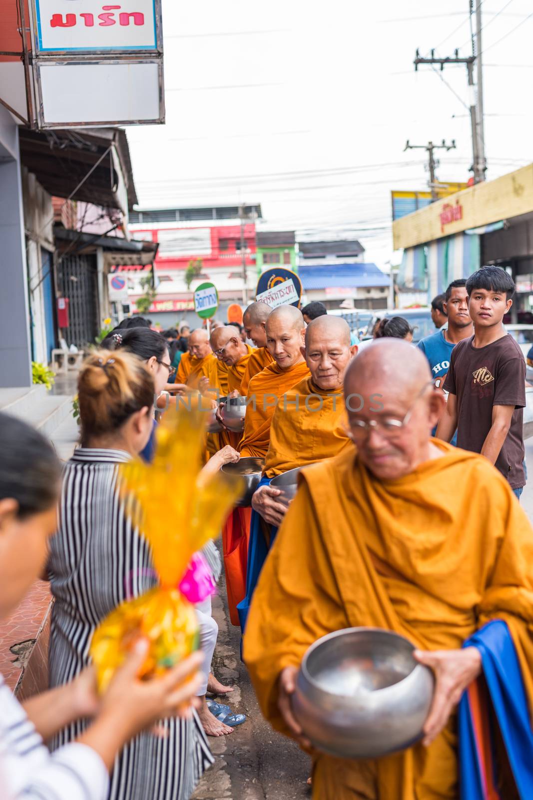 Chanthaburi, Thailand - July 9, 2017 : Unidentified Thai buddhism people in buddhist pray by Kathin Ceremony to make and off-season offering of robes and other needs to monks at Thai temple (Wat Thai)